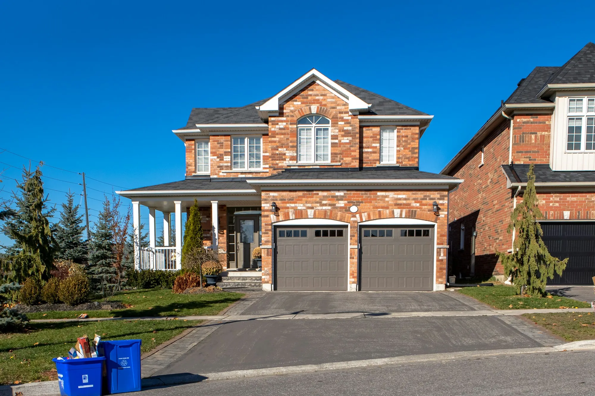 Brick two-story house with a double garage